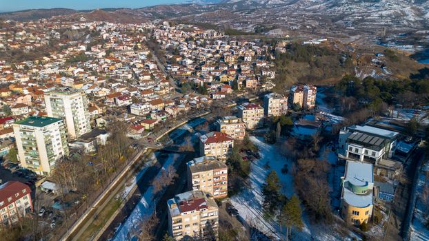 Discover the snowy cityscape of Shtip from above, showcasing its urban landscape in winter.