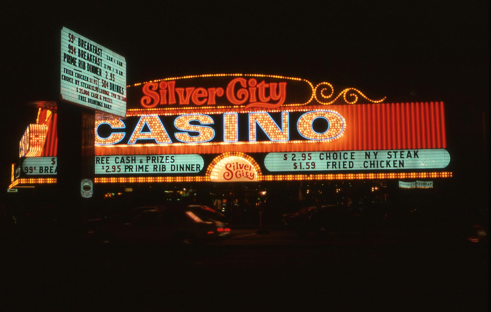 Illuminated Silver City Casino sign glowing at night, highlighting classic Las Vegas ambiance.