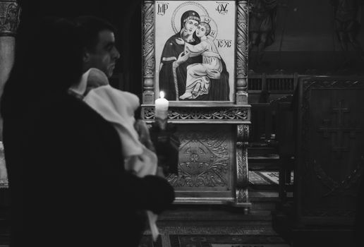 Black and white photo of a religious ceremony inside a church in Cluj-Napoca, Romania.