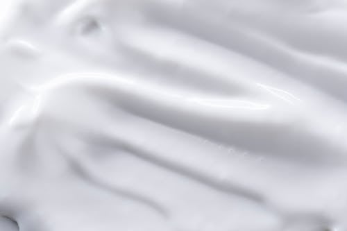 A close up of a white substance on a gray background