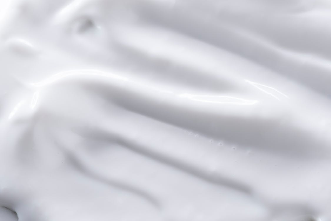 A close up of a white substance on a gray background