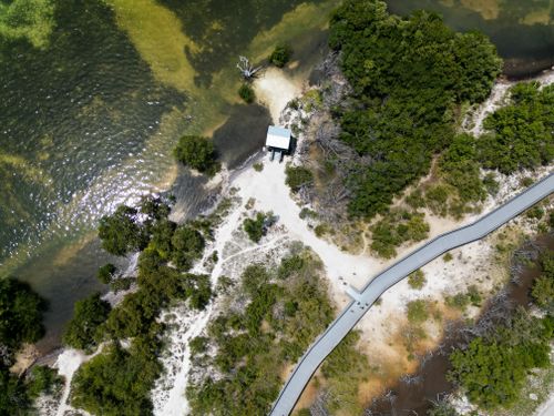 Free A stunning aerial view of Everglades City coastline with greenery and pathways. Stock Photo