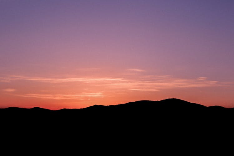 Silhouette Of Mountains At Dusk