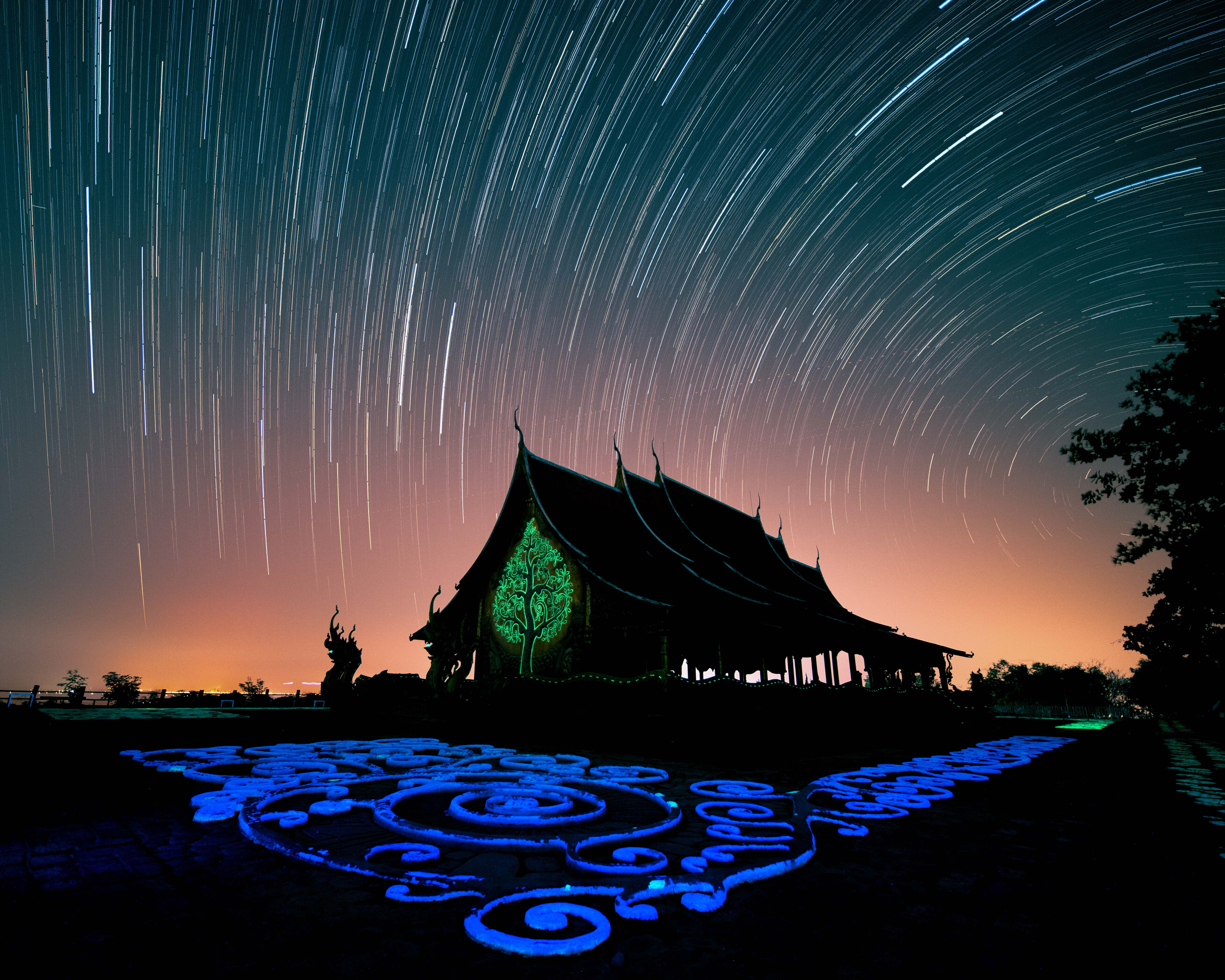 Captivating starry night sky over Wat Sirindhorn Wararam Phu Prao, Ubon Ratchathani.