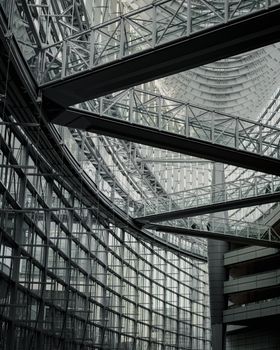 Intricate glass and steel design of a modern building in Tokyo, Japan.