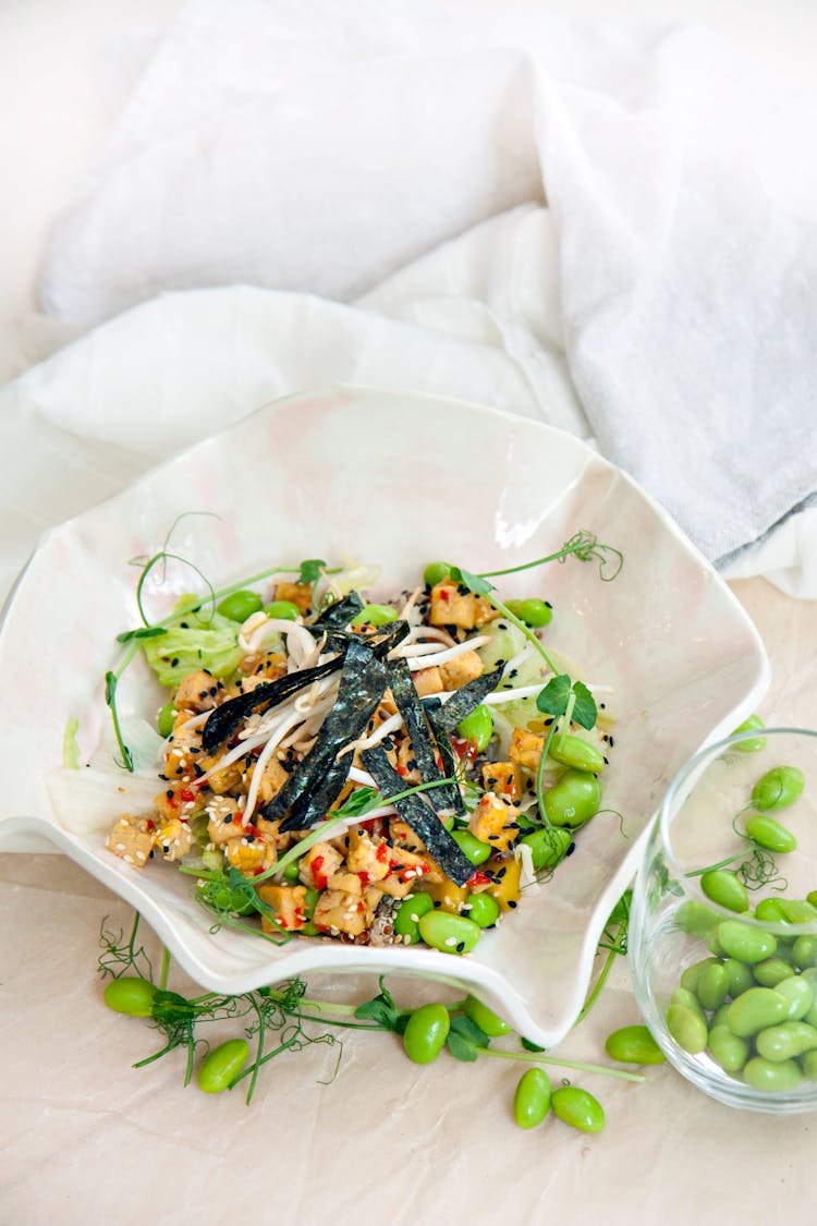 A Bowl Of Salad With Beans 