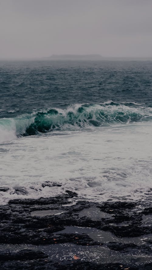 A photo of waves crashing on the shore