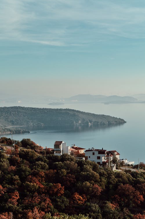 A house on a hill overlooking the sea and mountains