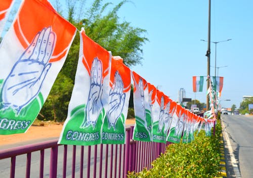 Hands on Flags of India Hanging on Road