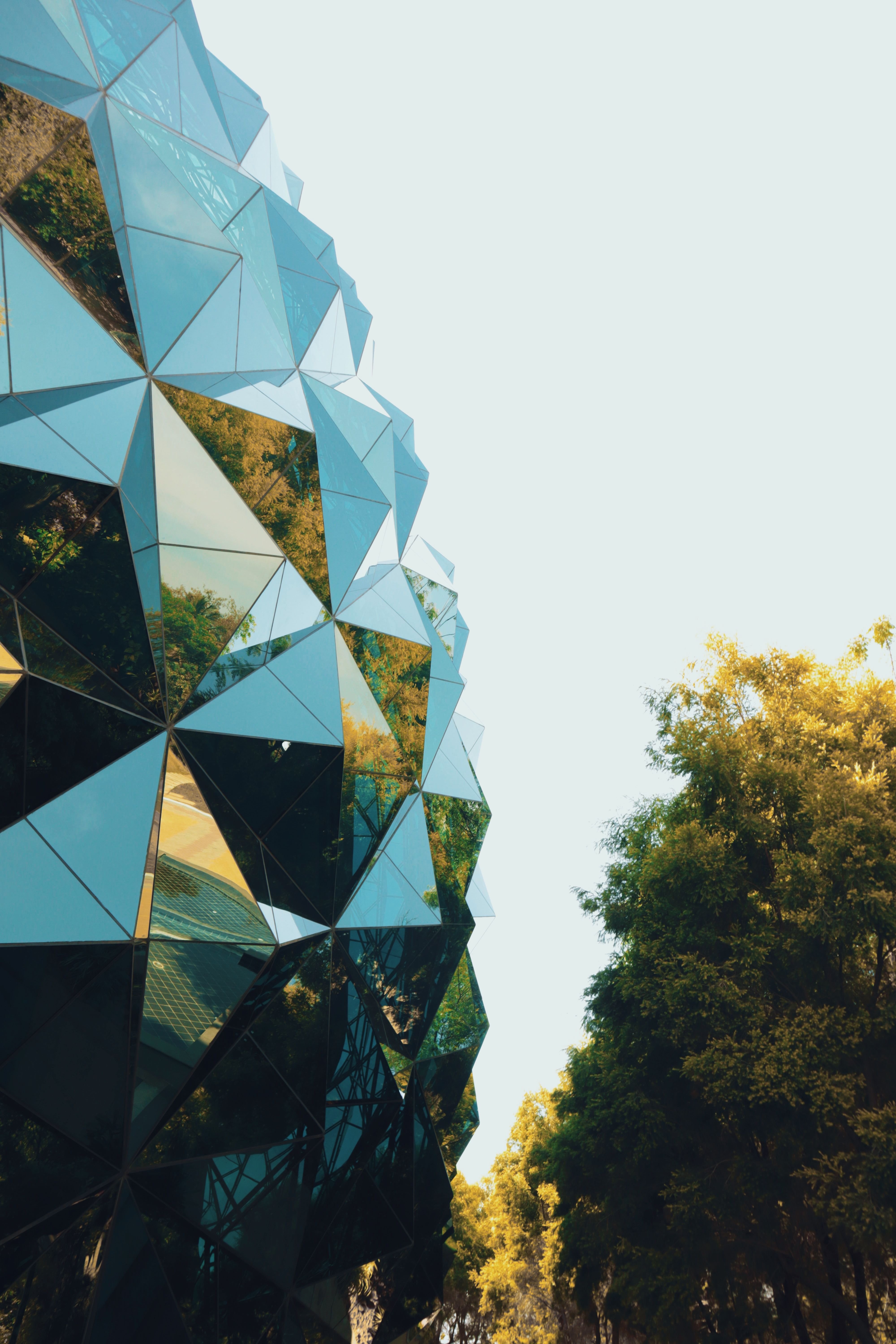 Building with a Geometric Reflective Facade · Free Stock Photo