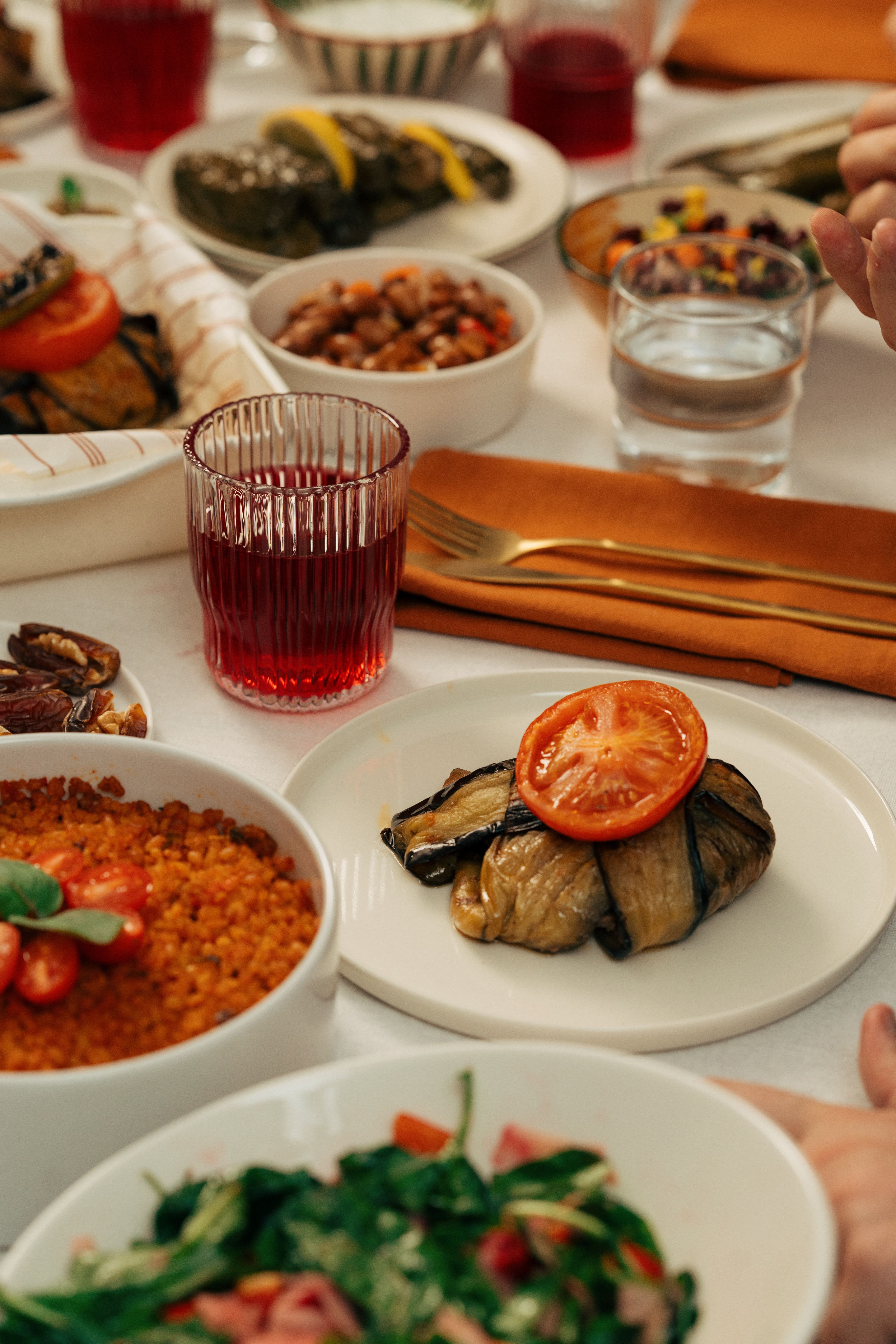 A vibrant table setting featuring traditional Turkish cuisine with various dishes and beverages.