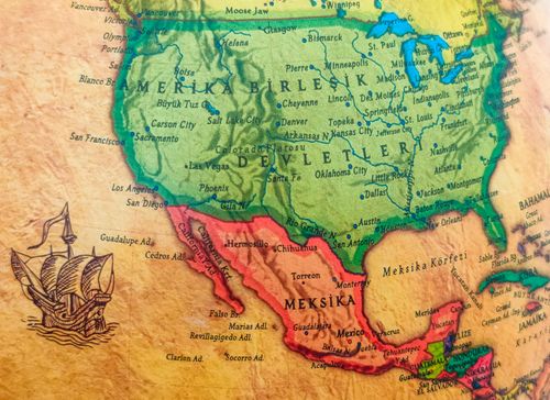 Free Detailed vintage map of North America featuring historic ship drawing. Highlights USA, Mexico, cities. Stock Photo