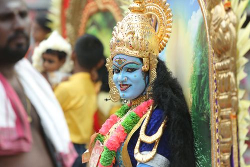 Free Vibrant portrayal of a performer in traditional Hindu attire during a festival in Thrissur, India. Stock Photo
