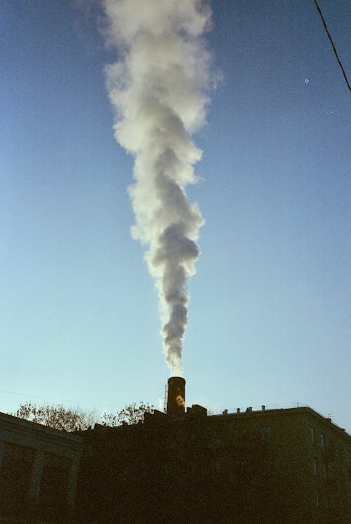 A large building with smoke coming out of it