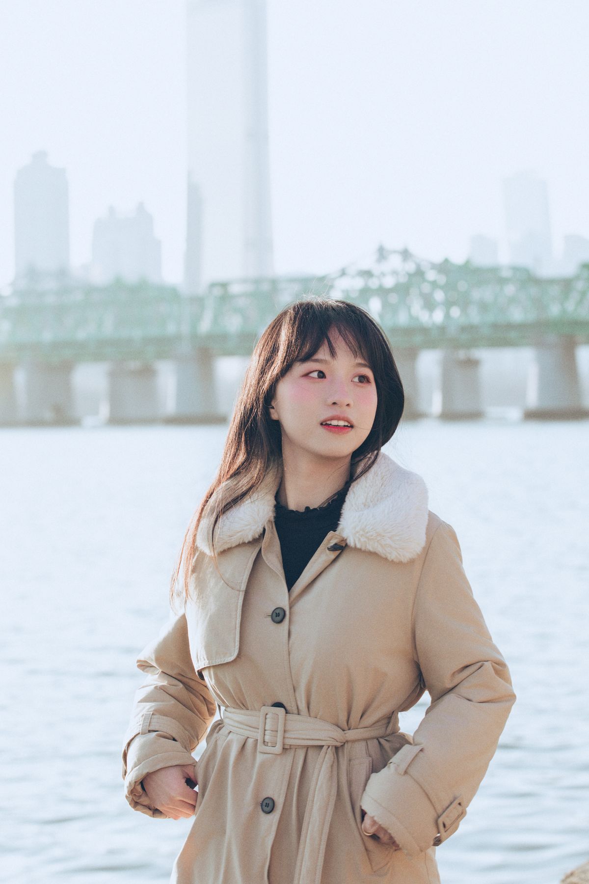 Korean woman wearing a beige trench coat in Seoul — Korean capsule wardrobe outerwear