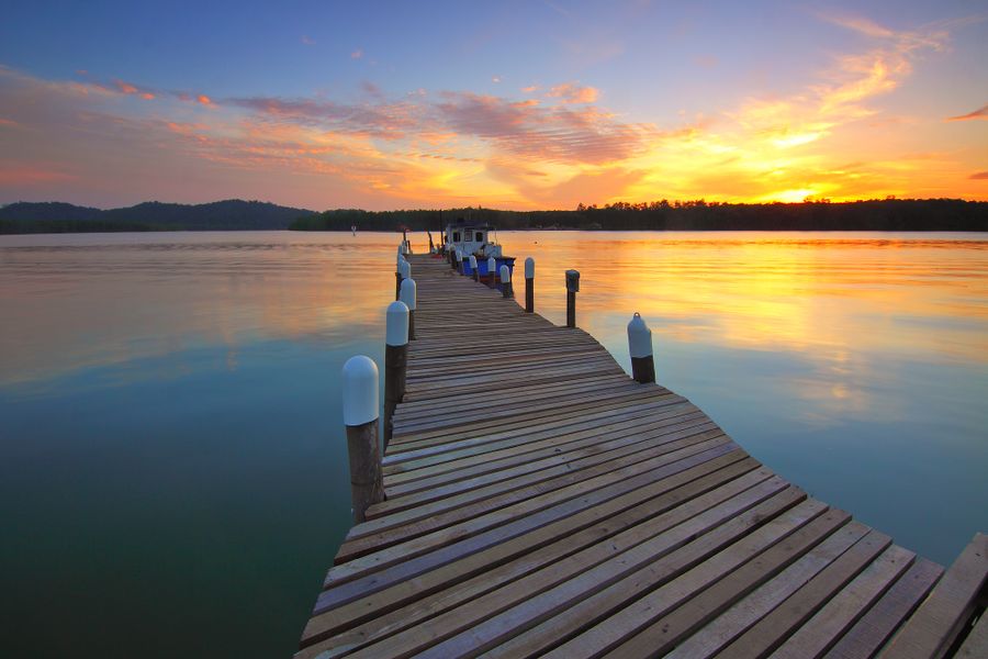 A wooden dock at sunset along the Lowcountry coast