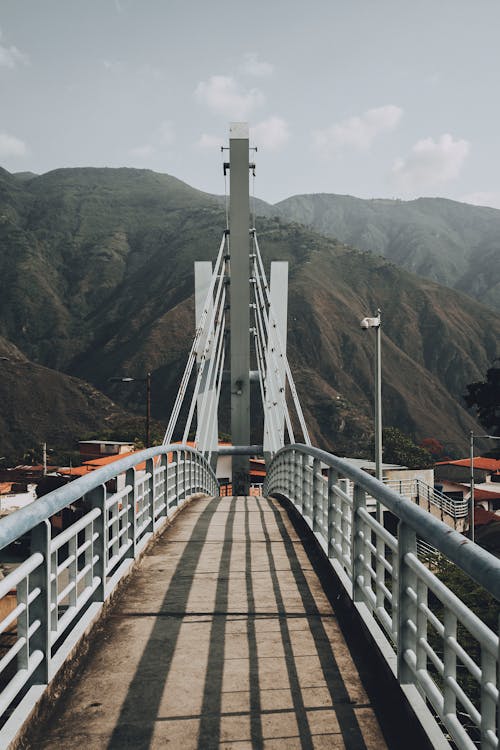 A bridge with a mountain in the background