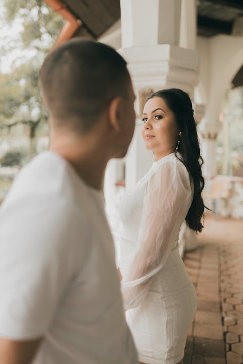 A man and woman are looking at each other