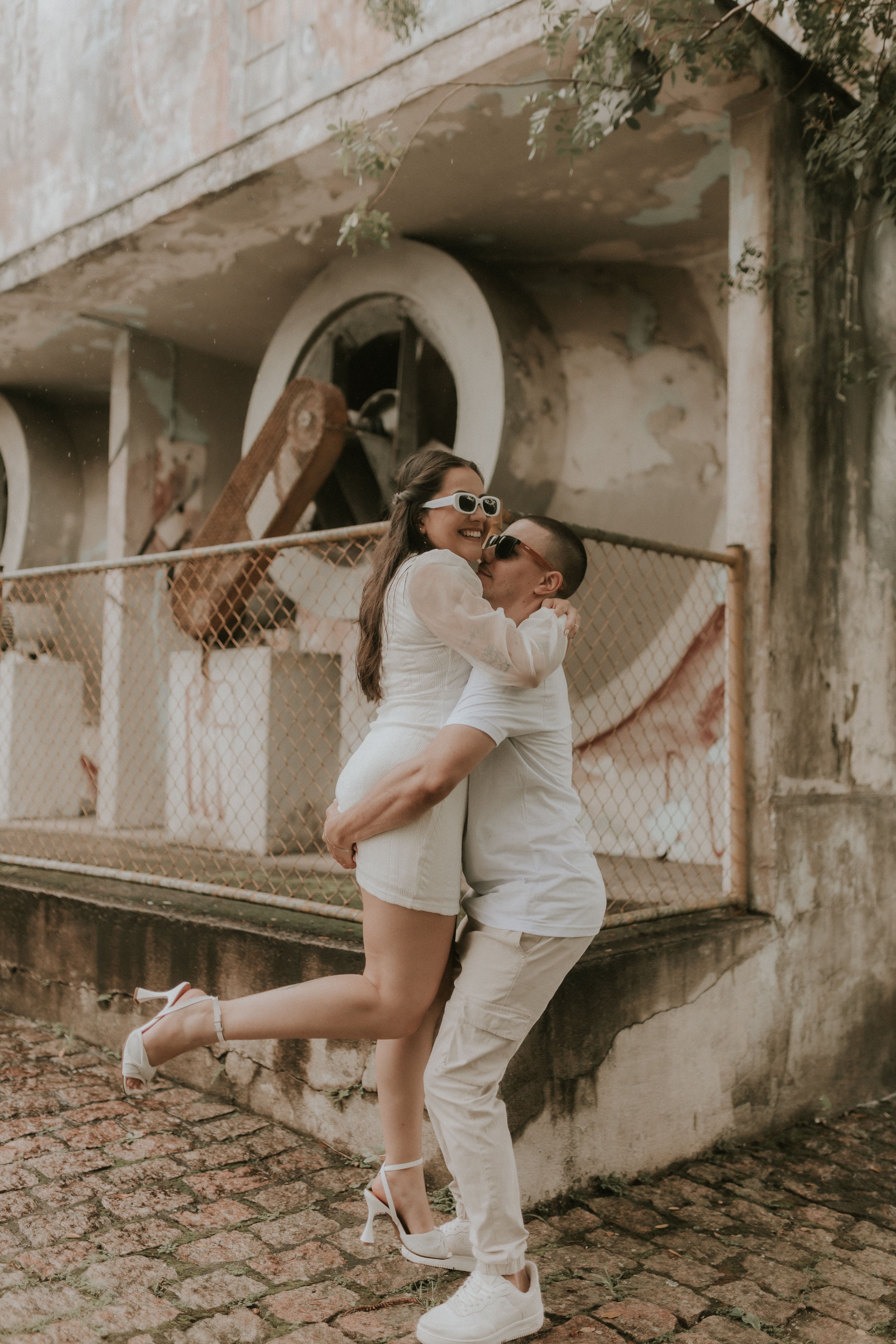 Man in White T-shirt Hugging Woman in White Dress · Free Stock Photo