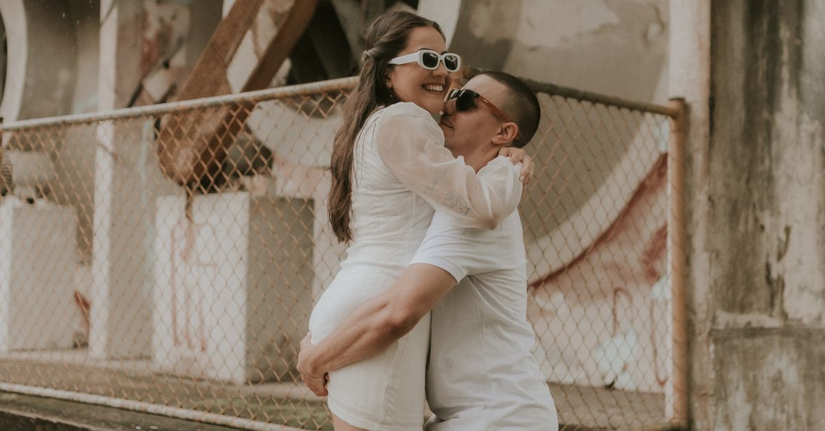 Hugging Clothes Man in White T-shirt Hugging Woman in White Dress · Free Stock Photo