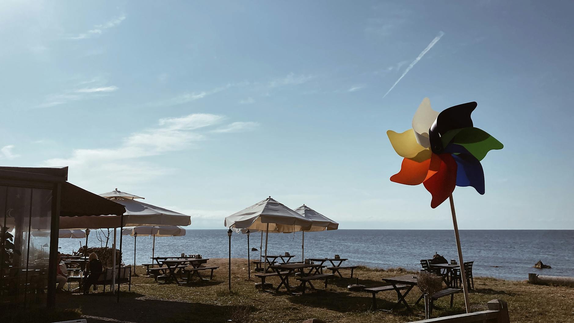 View of Tables and Chairs Standing on a Beach
