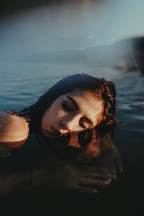 A woman is floating in the water
