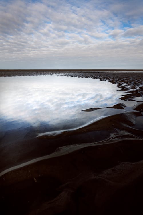 Gratis stockfoto met aan het strand, eb, gezwollen wolken