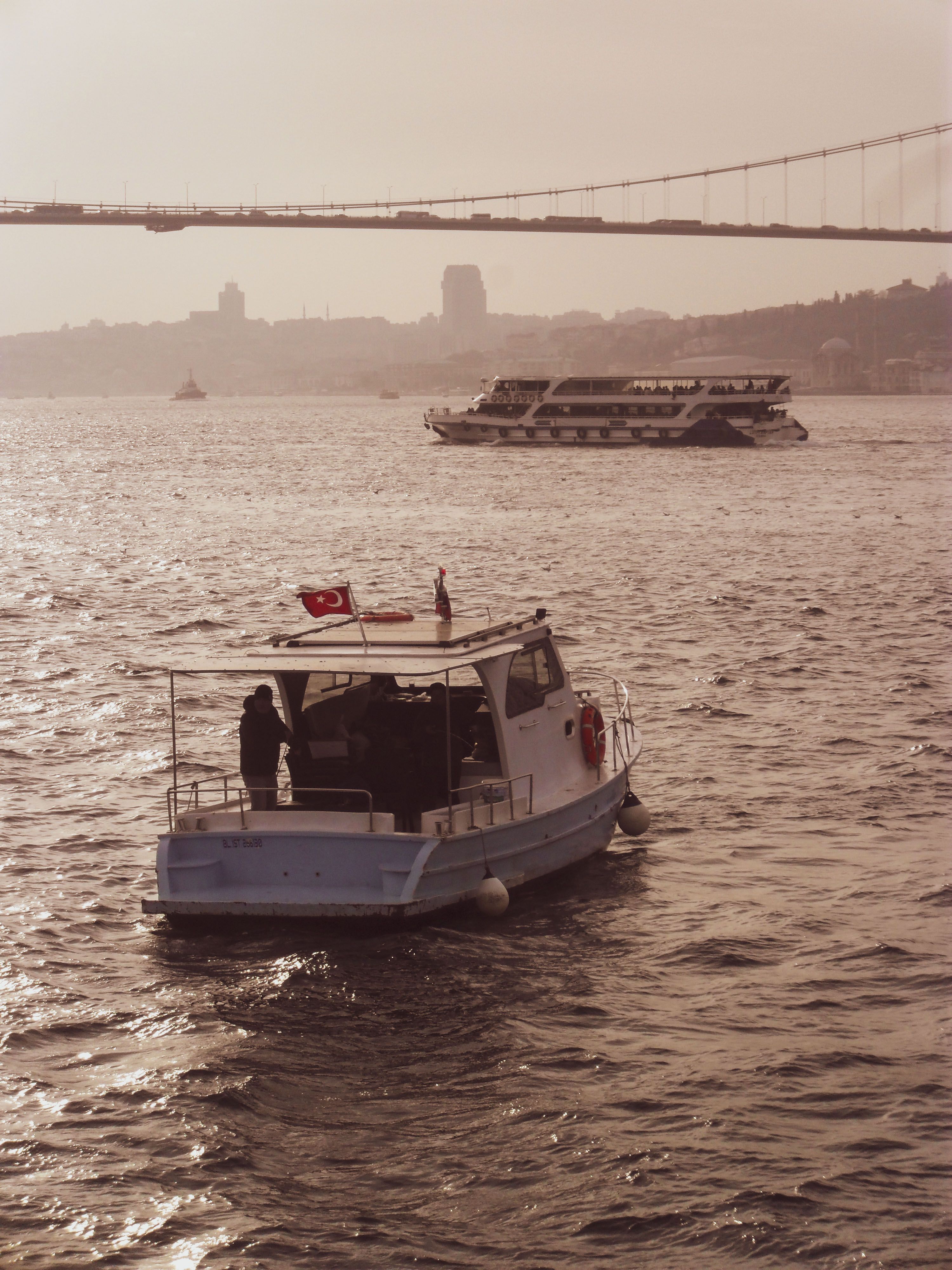 Motorboat and a Ferry on the Bosphorus Strait · Free Stock Photo