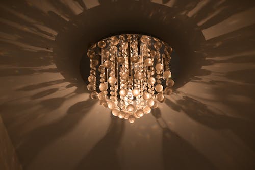 A ceiling light with a crystal chandelier