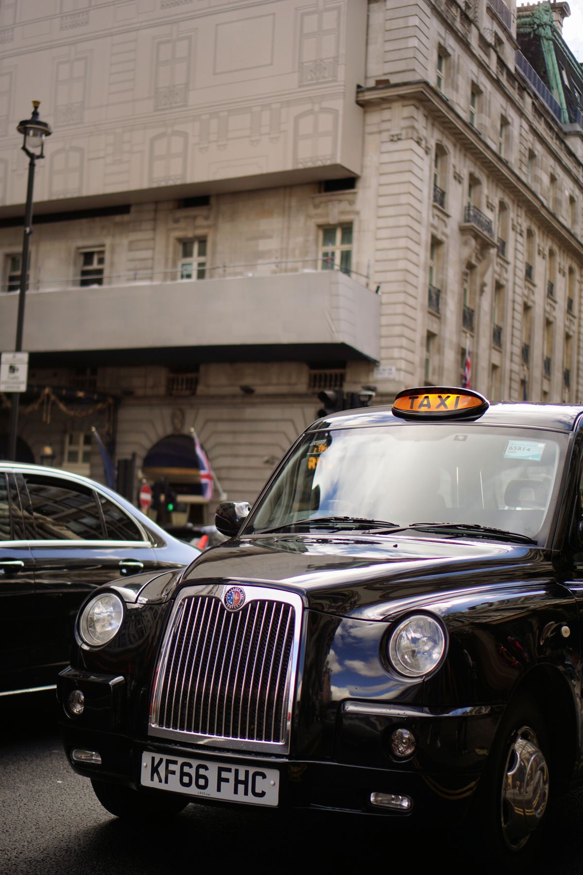 Close-up of a black London taxi on a city street