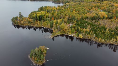 Free Scenic view of a forested island and a serene lake in Kronoberg County, Sweden, captured from above. Stock Photo