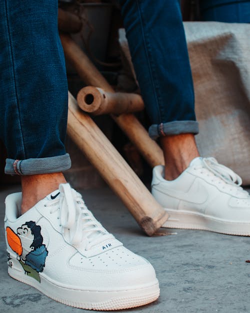 Free Person Wearing White Nike Air Force 1 Sneakers Stock Photo