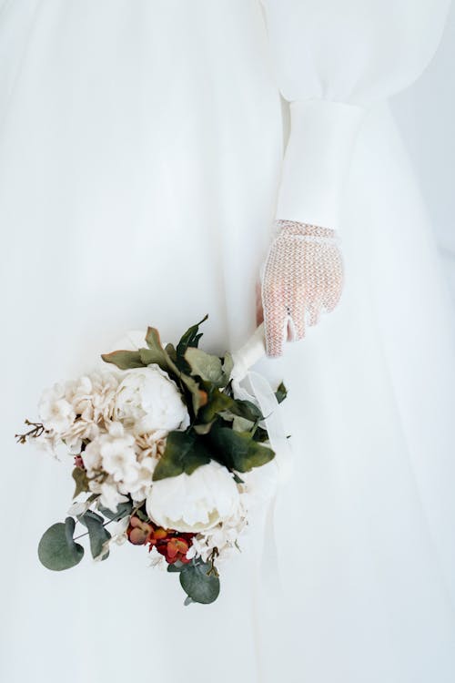 Bride Holding a Bouquet of Flowers 