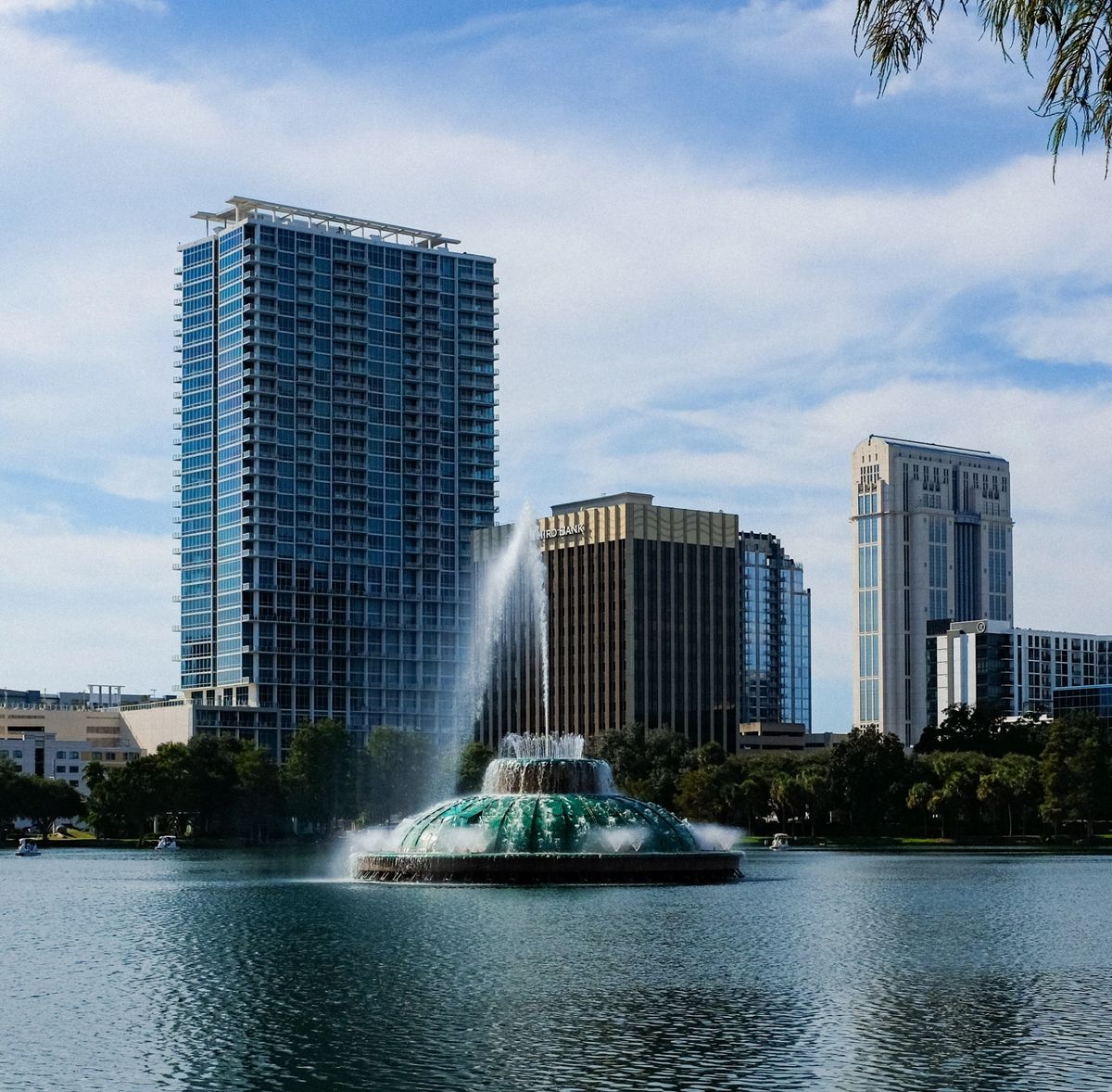 Lake Eola Park fountain with the downtown Orlando skyline behind it