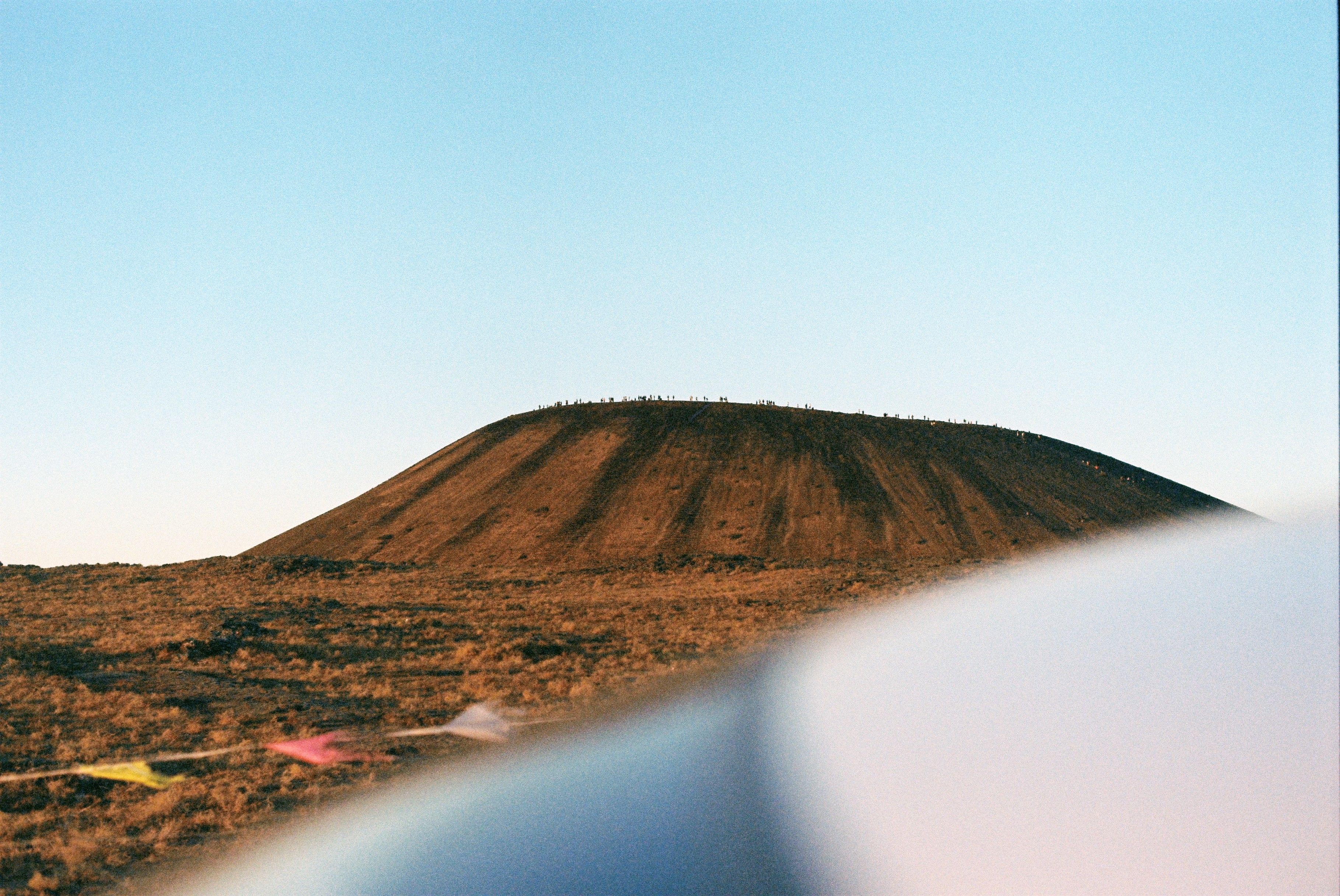 Clear Sky over Barren Hill · Free Stock Photo