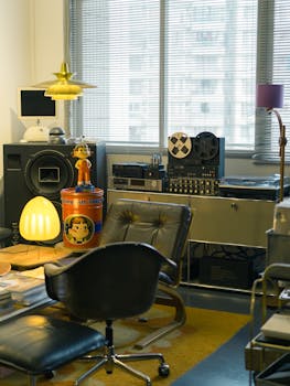 Retro-themed room featuring vintage audio equipment, leather chairs, and retro decor elements under soft lighting.