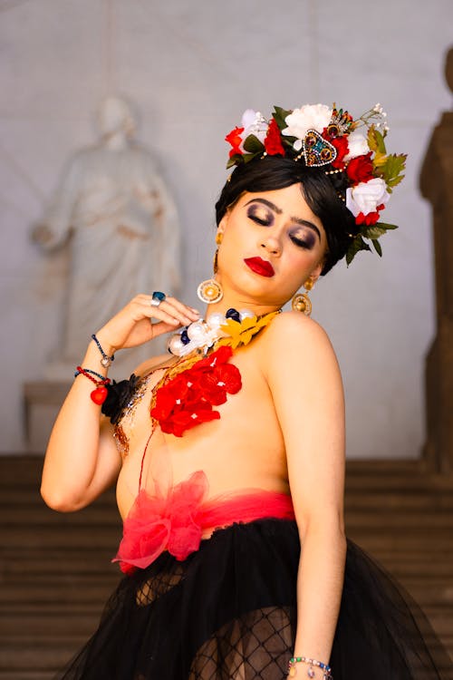 A woman in a black and red dress with flowers