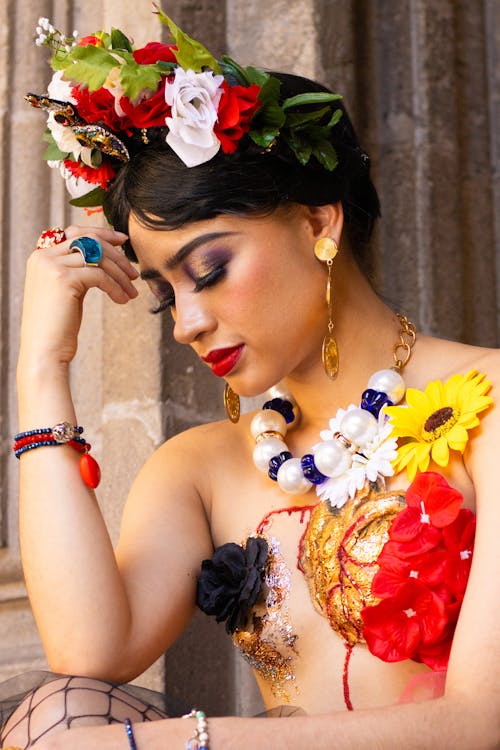 A woman in a flower crown and jewelry