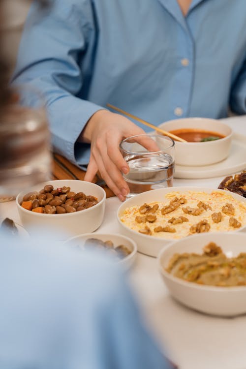 A woman is eating food at a table