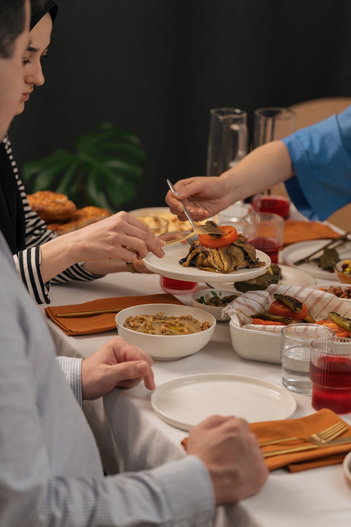 People sharing food around a table