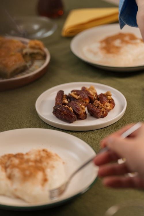 Free A close-up of traditional Middle Eastern desserts including baklava and dates. Stock Photo
