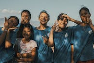 A Group of Happy Girls Standing Outside