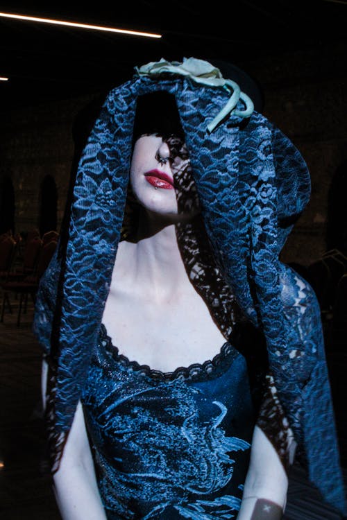 A mannequin wearing a blue dress and veil
