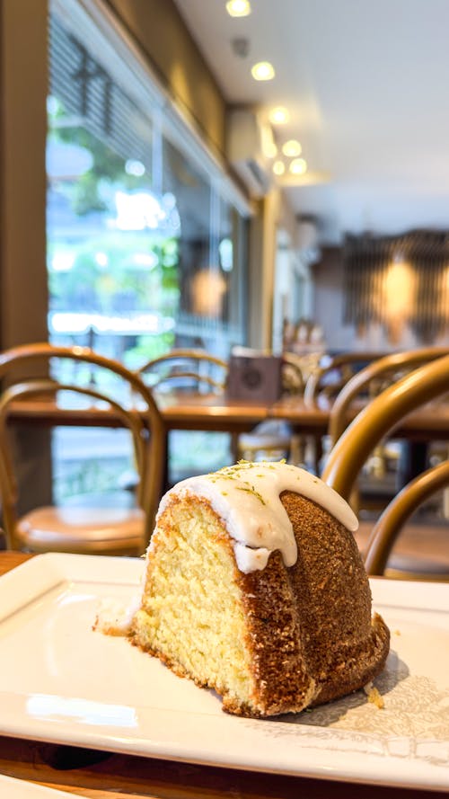 A piece of cake sitting on a plate on a table