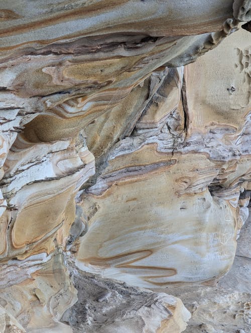 A close up of a rock formation with a lot of different colors