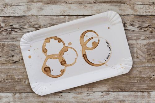 Free A rustic white tray with artistic coffee stains and 'I love coffee' text. Stock Photo
