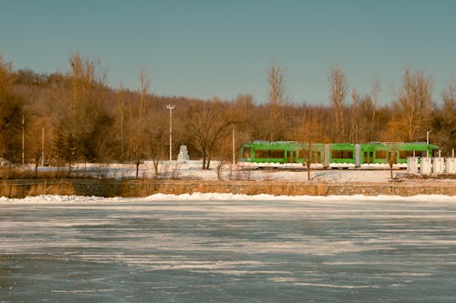 A train is traveling through a frozen lake