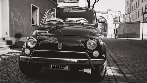 Free Vintage Fiat 500 in a classic black and white urban setting on a Munich street. Stock Photo