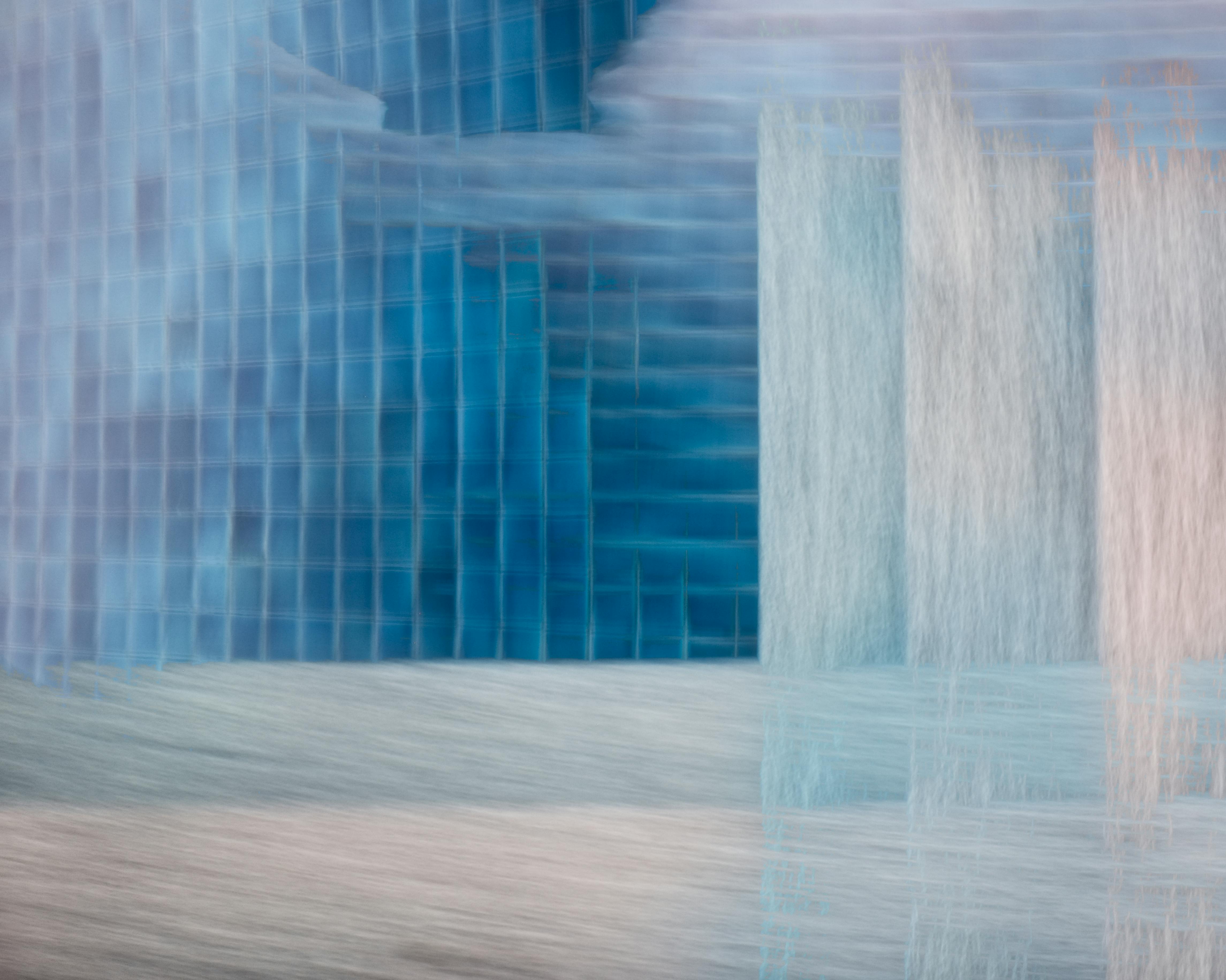 Abstract image featuring blue and gray geometric patterns and textures.