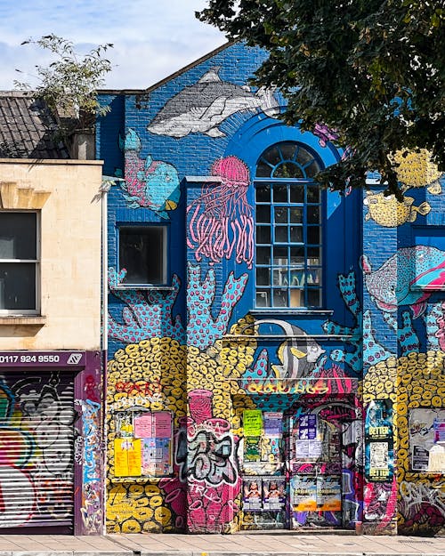 graffiti clad blue building in Bristol